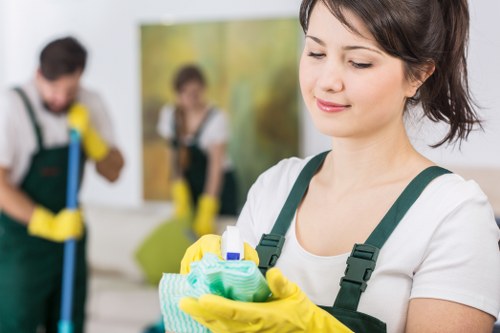 Close-up of a technician inspecting a rug before cleaning in West Hampstead